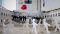 Image shown: Art installation depicting paper dolls holding hands: Arts