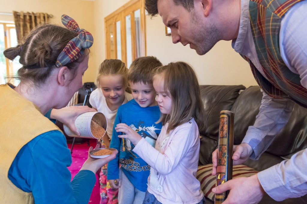 Image shown: Pop Up Picnic visits a family home in Kildare in 2017 with performer Niamh Lawlor and musician Thomas Johnston. Photo credit: Brian Cregan.